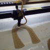 图案布料皮料摄像头激光切割加工厂  大型布料激光切割加工厂